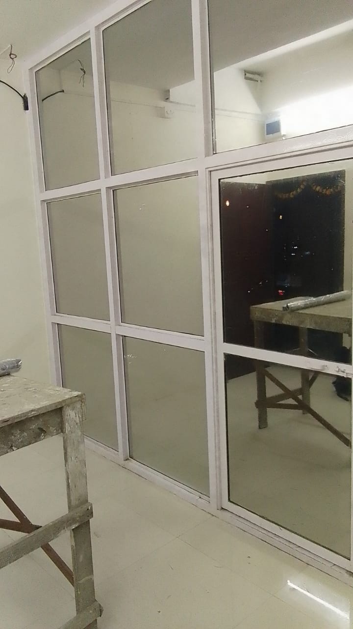Glass grid partition part-way through filming, with frosted panes on the left bay and clear panes on the right