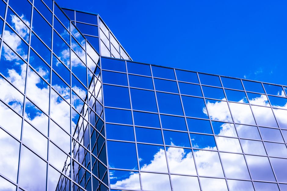 Silver reflective mirror film on commercial office tower exterior glass, BKC Mumbai